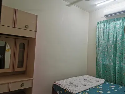 a small room with a bed and a cabinet at Homestay Taman Mas, Kg Koh in Sitiawan