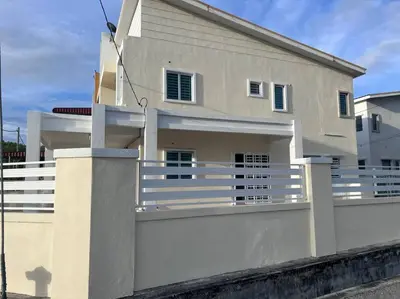 a white house with a white fence at D' Tronoh Home in Teronoh