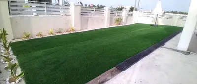 a patio with a green lawn on a building at D' Tronoh Home in Teronoh