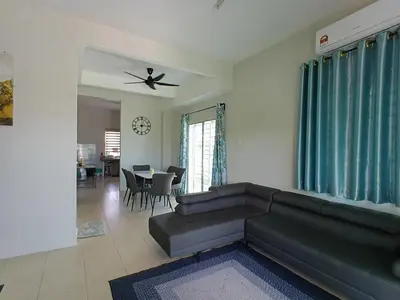 a living room with a couch and a table at D' Tronoh Home in Teronoh