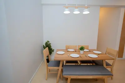 a dining room with a wooden table and chairs at Muna The Cove Ipoh Garden East 3R2B 8pax in Ipoh