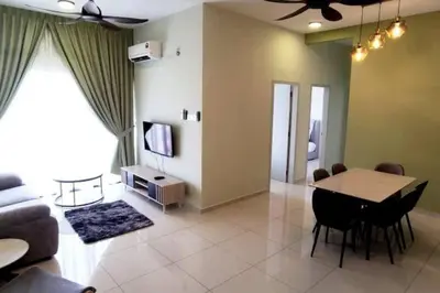 a living room with a table and a couch at The Horizon Ipoh Stay by Grab A Stay in Ipoh