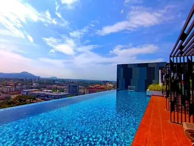 a swimming pool on the roof of a building at The Horizon Ipoh Stay by Grab A Stay in Ipoh