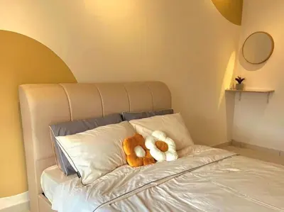 a couple of teddy bears sitting on top of a bed at Mocha Suite @ The Horizon Ipoh [4 to 6 pax] in Ipoh