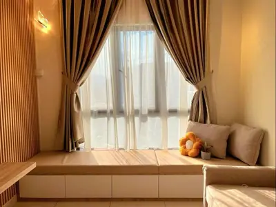 a teddy bear sitting in front of a window at Mocha Suite @ The Horizon Ipoh [4 to 6 pax] in Ipoh