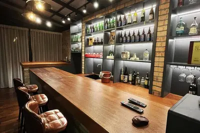 a bar with a wooden counter and some bottles of alcohol at LOW SEASON PROMOTION! 4B12B Bar 5 min City Center in Ipoh
