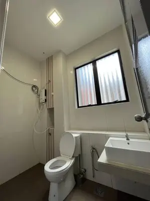 a bathroom with a toilet and a sink and a window at LOW SEASON PROMOTION! 4B12B Bar 5 min City Center in Ipoh