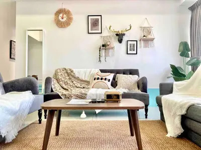 a living room with a couch and a coffee table at Tropicana 218 Macalister #Top Floor #WideAngleViews #InfinityPool #Georgetown #8pax #3BR 2bath #2Queen 4Single #Near island hospital #Quality well maintained #Private host in George Town