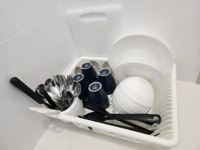 a plastic container filled with utensils and dishes at The Horizon - Ipoh in Ipoh