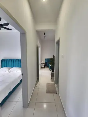 a bedroom with a bed and a room with a hallway at The Horizon - Ipoh in Ipoh