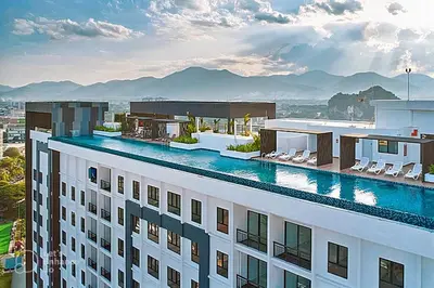 a hotel with a swimming pool on top of a building at Ipoh City Executive Suite - The Horizon in Ipoh