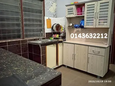 a kitchen with a sink and a counter top at Ekaira homestay in Tambun