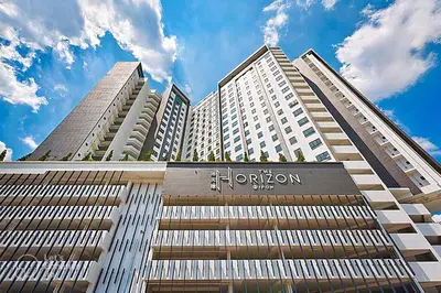 a tall building with a sign on the front of it at Horizon Premium Suite - Ipoh in Ipoh