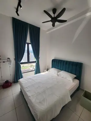 a bedroom with a bed and a ceiling fan at Horizon Premium Suite - Ipoh in Ipoh