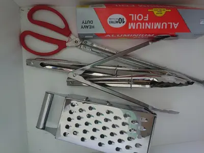 a pair of scissors and a box on a wall at Villa with Titiwangsa Hill View in Kerling