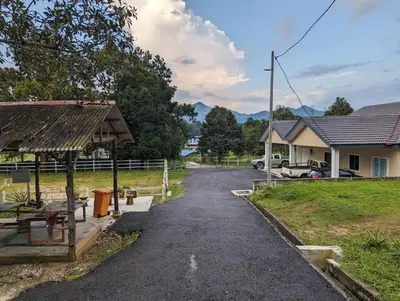 a road leading to a house and a house at Villa with Titiwangsa Hill View in Kerling