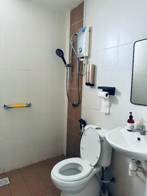 a bathroom with a shower and a toilet and a sink at Hot Picks SmartTV Netflix Seaview Homestay Sekinchan in Sekincan