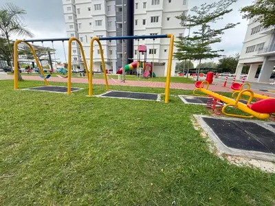 a playground in a park with colorful swings at Balcony Forest Lake Mountain in Kampar