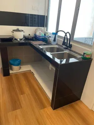 a kitchen with a sink and a counter top at Adik Aisyah classic 2 in Cameron Highlands