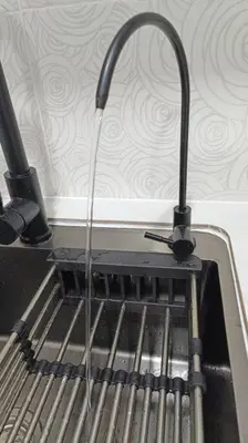 a kitchen sink with a hose coming out of it at Honeyz Waterpark Homestay. in Ipoh