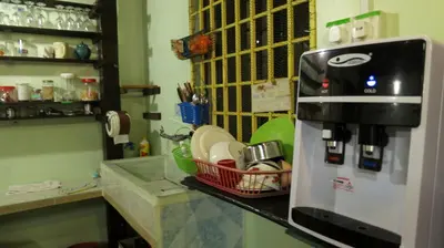 a coffee maker sitting on a counter in a kitchen at Pangkor Guesthouse SPK in Pangkor