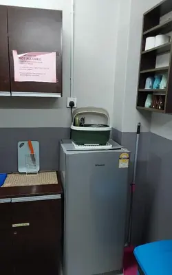 a small refrigerator with a pot on top of it at BRICKS Backpackers Sleepbox in Tanah Rata