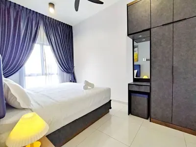 a bedroom with a bed with purple curtains and a mirror at Urbanite Premier Suite - Horizon Ipoh by Grab A Stay in Ipoh