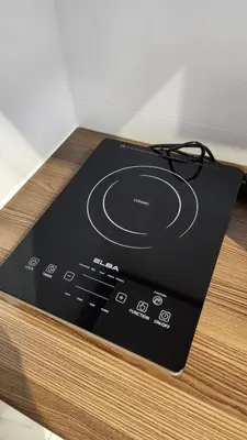 a electronic device sitting on top of a wooden table at Urbanite Premier Suite - Horizon Ipoh by Grab A Stay in Ipoh