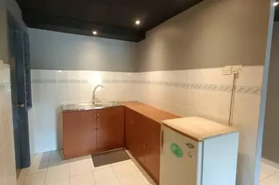 a small kitchen with a sink and a refrigerator at Coral Bay \u5c0f\u578b\u516c\u5bd3 in Pasir Bogak