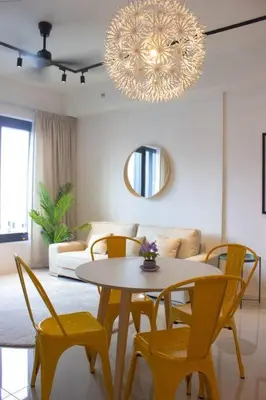 a living room with a table and chairs and a chandelier at Comfy Stay x 218 Macalister 2BR (Georgetown) \u4e54\u6cbb\u5e02\u4e2d\u5fc3 in George Town