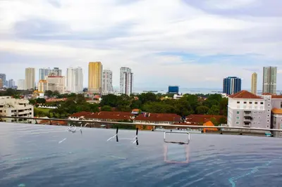 a swimming pool with a city skyline in the background at Comfy Stay x 218 Macalister 2BR (Georgetown) \u4e54\u6cbb\u5e02\u4e2d\u5fc3 in George Town