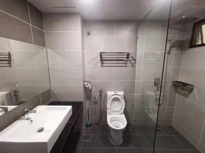a bathroom with a sink and a toilet and a shower at COZY HOME COPTHONE RESORT in Brinchang