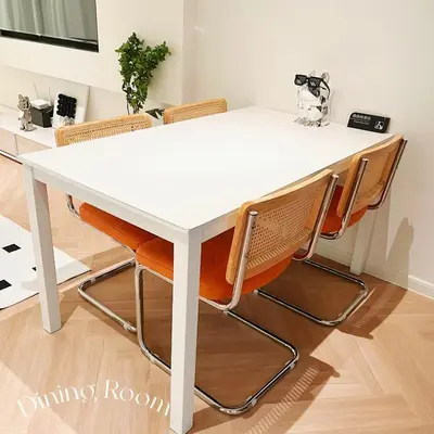 a white dining room table with orange chairs at The Beacon Executive Penang Georgetown in George Town