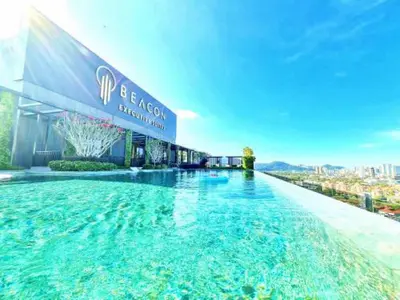 a large swimming pool in front of a building at The Beacon Executive Penang Georgetown in George Town