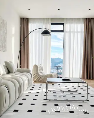 a living room with a white couch and a table at The Beacon Executive Penang Georgetown in George Town