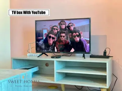 a tv screen with a group of men on it at Catty Suite Prai • 3BR • 2Carparks@6mins PG Bridge in Perai