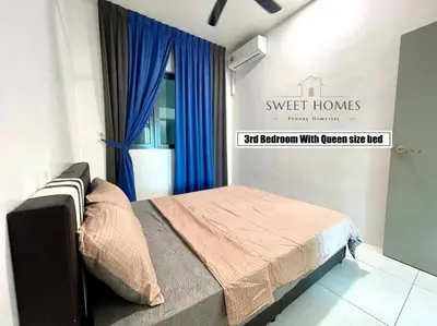 a bedroom with a bed with blue curtains and a sign at Catty Suite Prai • 3BR • 2Carparks@6mins PG Bridge in Perai