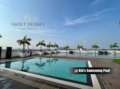 a swimming pool on the roof of a building with palm trees at Catty Suite Prai • 3BR • 2Carparks@6mins PG Bridge in Perai