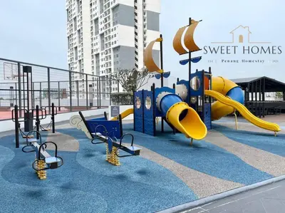 a playground with a slide and swings at Catty Suite Prai • 3BR • 2Carparks@6mins PG Bridge in Perai