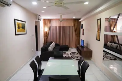 a living room with a couch and a table at Taiping Modern Home in Kamunting