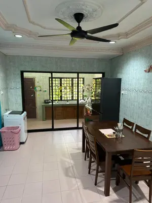 a dining room with a table and a ceiling fan at Thumbs Up HomeStay in Kampong Jalan Berop