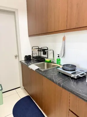 a kitchen with a sink and a counter top at The Horizon Ipoh By Iconique Espace in Ipoh