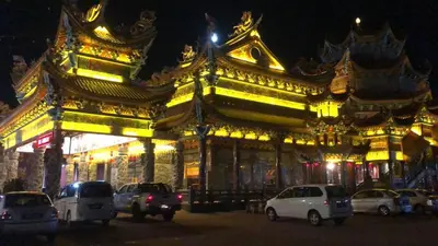a building with cars parked in front of it at night at BUTTERWORTH RAJA UDA RAYA HOMESTAY in Butterworth