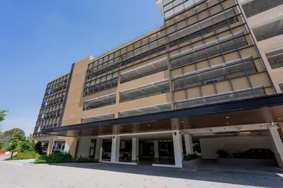 an office building with a lot of windows at Ipoh Tambun Lost World Sunway Onsen Mina 3R2B 8pax in Tambun