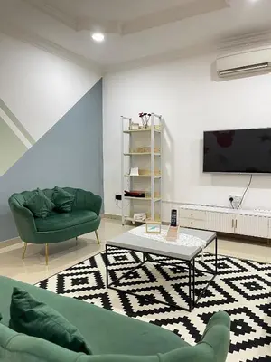 a living room with a couch and a tv at Unique 4 Bedrooms House, Few mins to Town by Mr Homestay in Teluk Intan