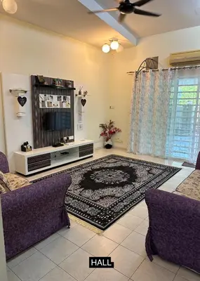 a living room with a tv and a rug at Tamu House Botani in Ipoh