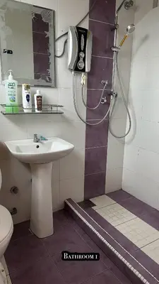 a bathroom with a sink and a shower at Tamu House Botani in Ipoh