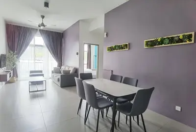 a dining room with a table and chairs in a living room at G Residence - 2R2B Barrington Night Market (1) in Brinchang