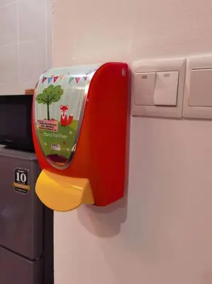 a red and yellow dispenser on the side of a refrigerator at G Residence - 2R2B Barrington Night Market (1) in Brinchang