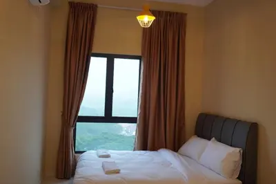 a bedroom with a bed with a large window at The Horizon Ipoh Infinity Pool 5 to 9pax in Ipoh